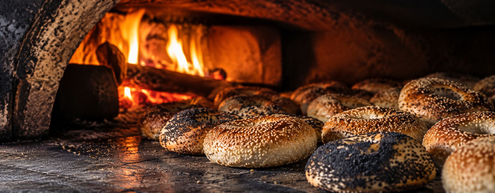 Bagels baking in a wood-fired oven